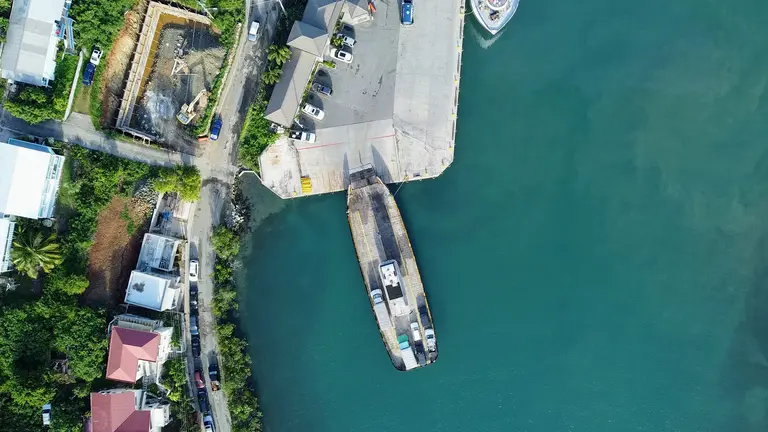 Top-down aerial view of a ferry at a dock